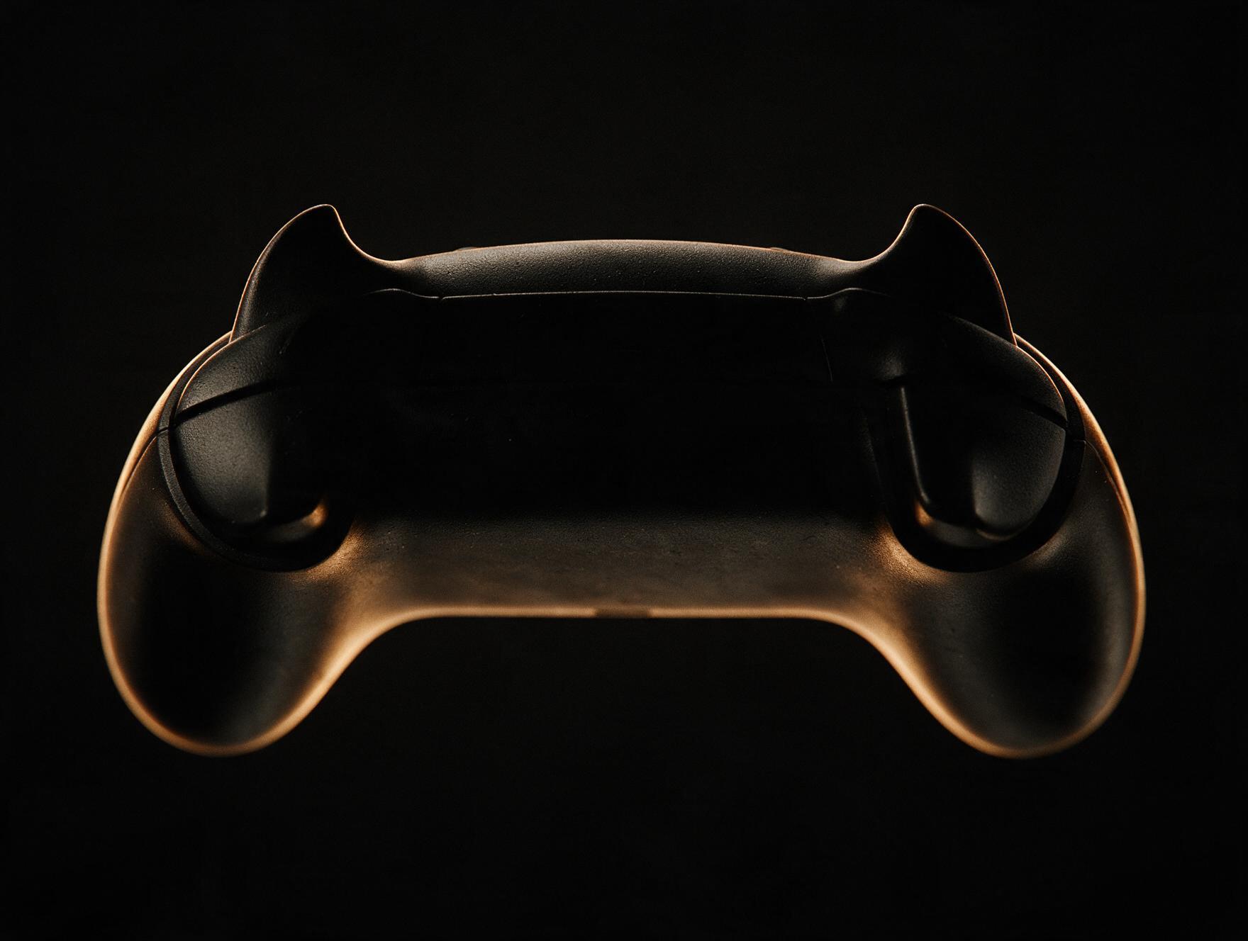 A games controller in silhouette, edge lit